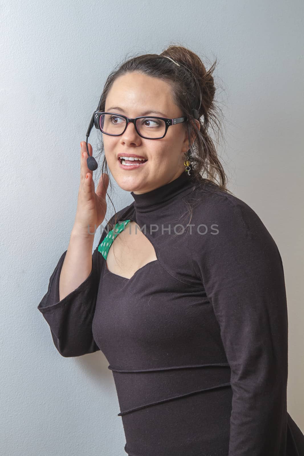 thirty something phone agent with headset having a conversation