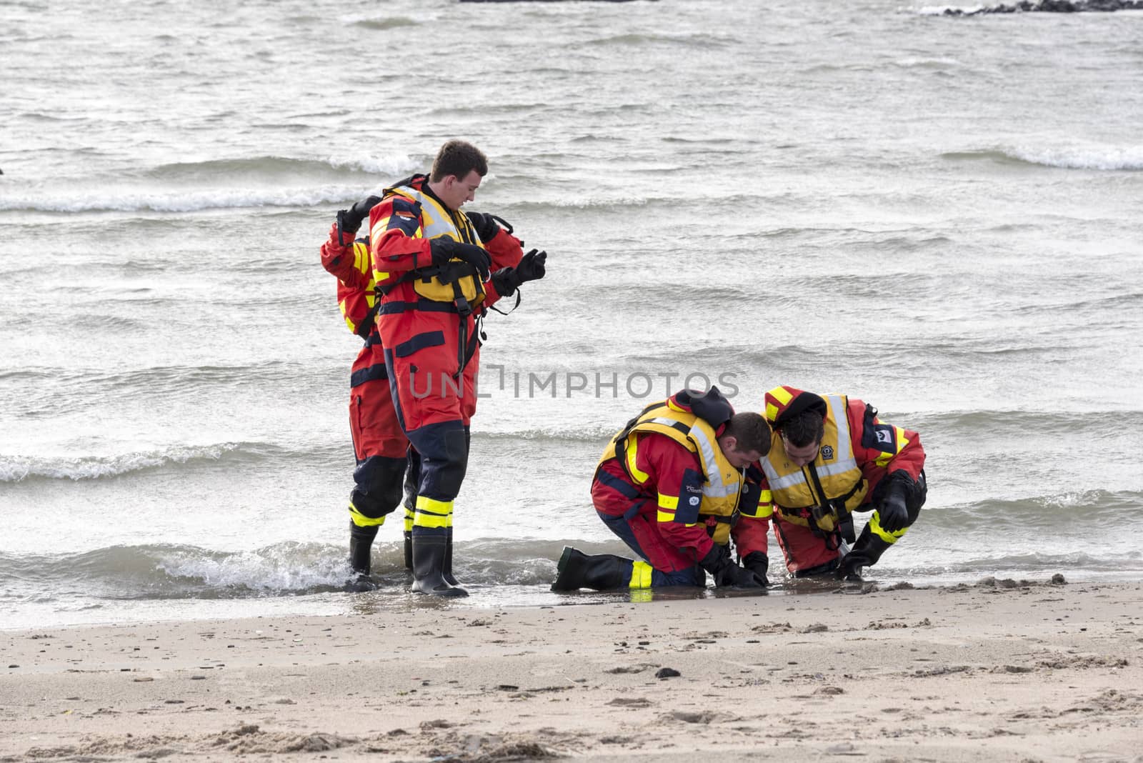 rescue divers checking the water for the new years dip in Holland