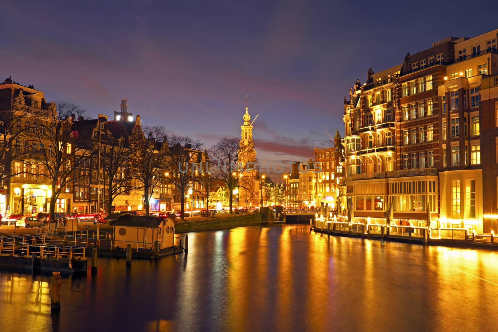City scenic from Amsterdam in the Netherlands by night with the Munttower