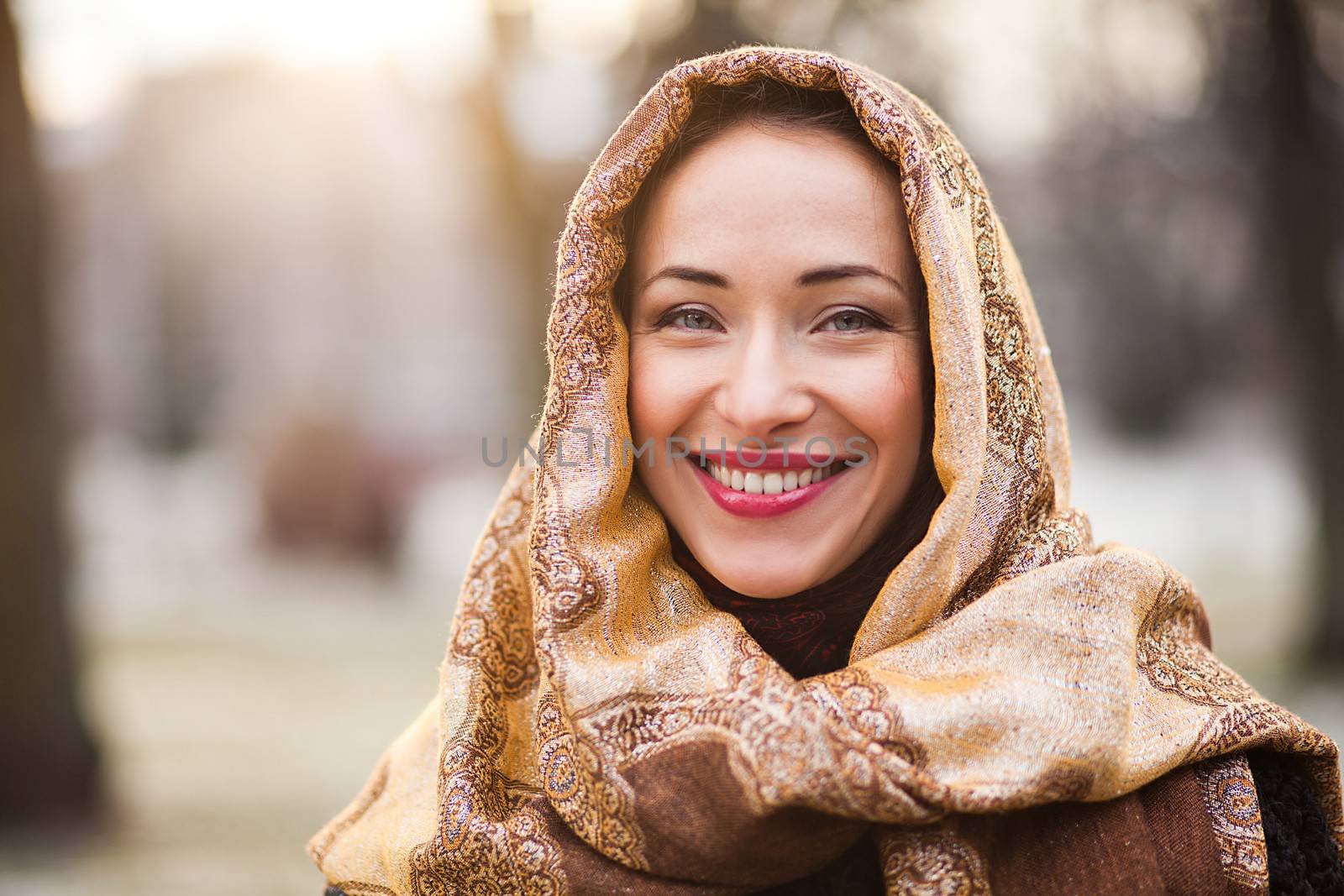 Smiling young and happy business woman wearing headscarf