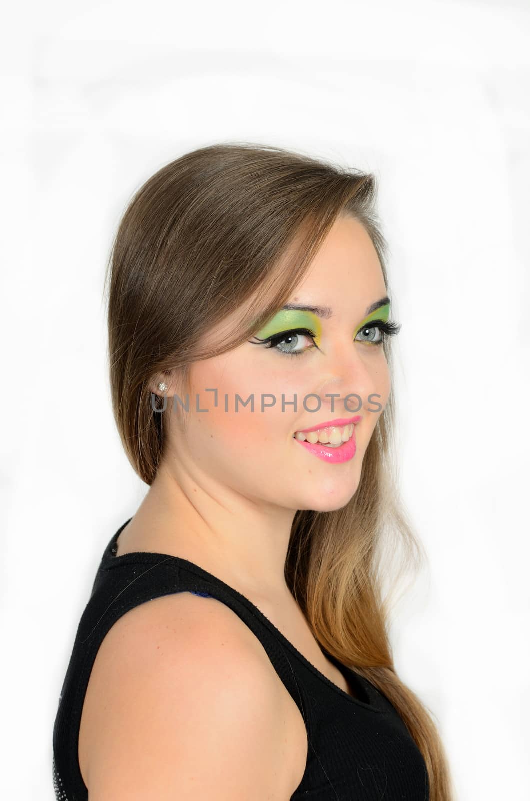 Close up portrait of young female model with blond hairs. Teenager from Poland, smiling face and colorful makeup.