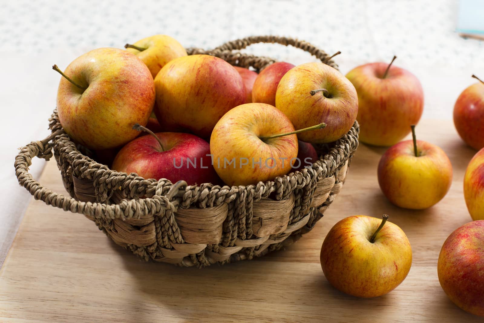Basket of yellow and red apples