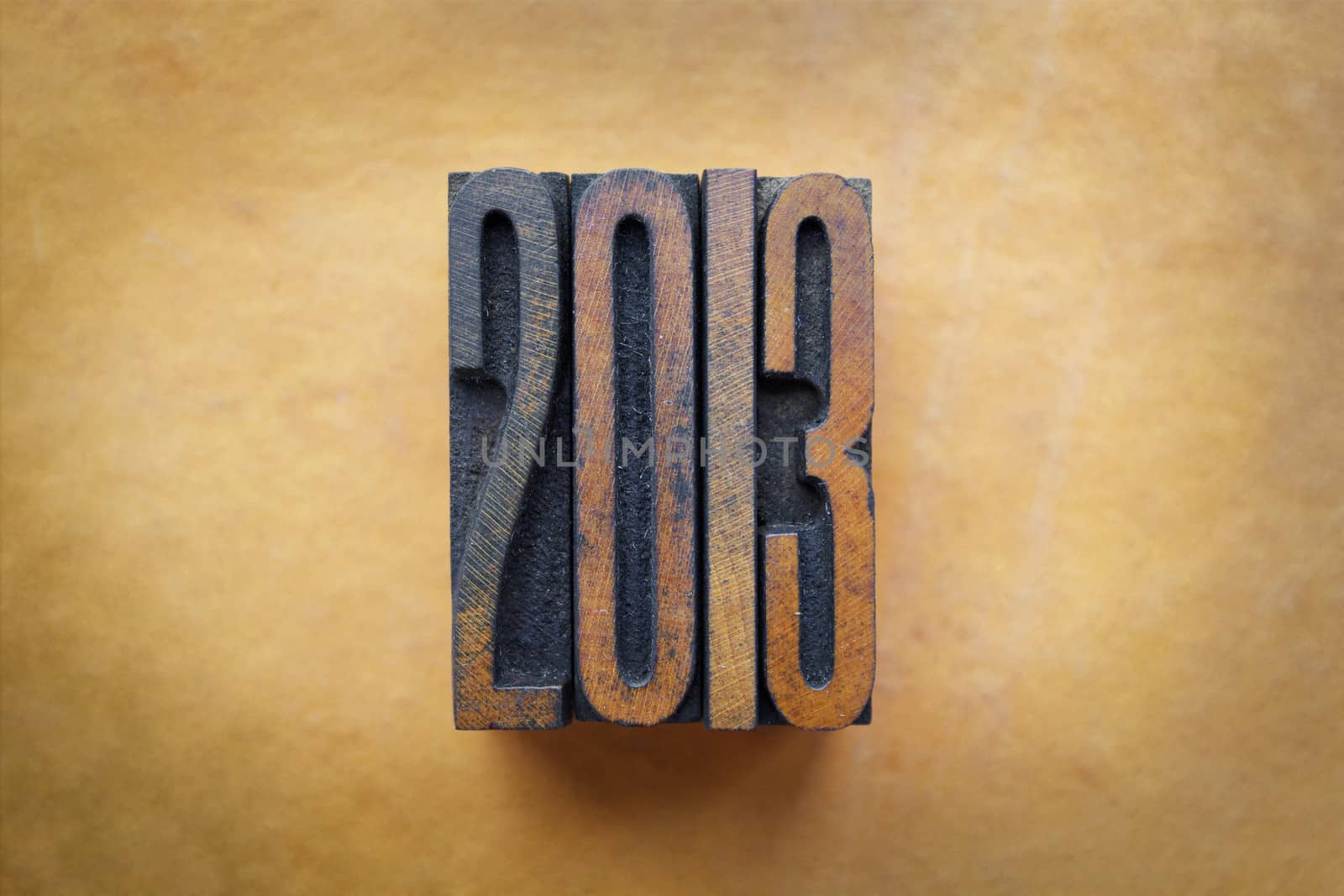 The year 2013 written in vintage letterpress letters.