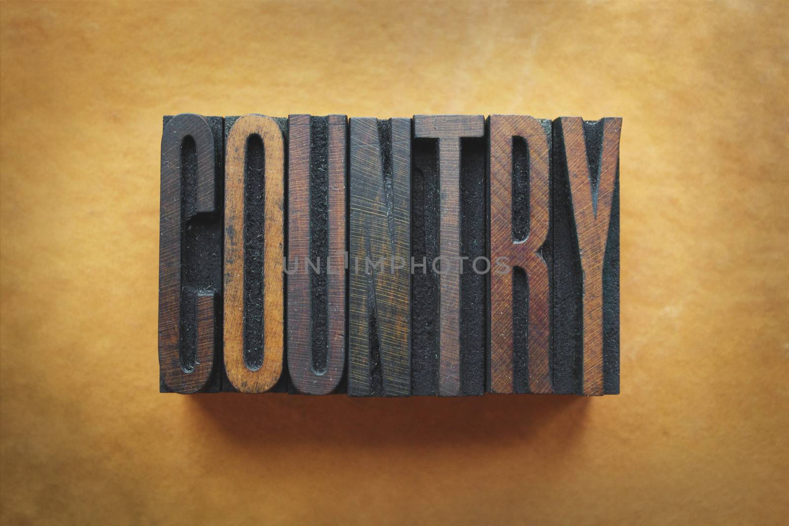 The word COUNTRY written in vintage letterpress type.