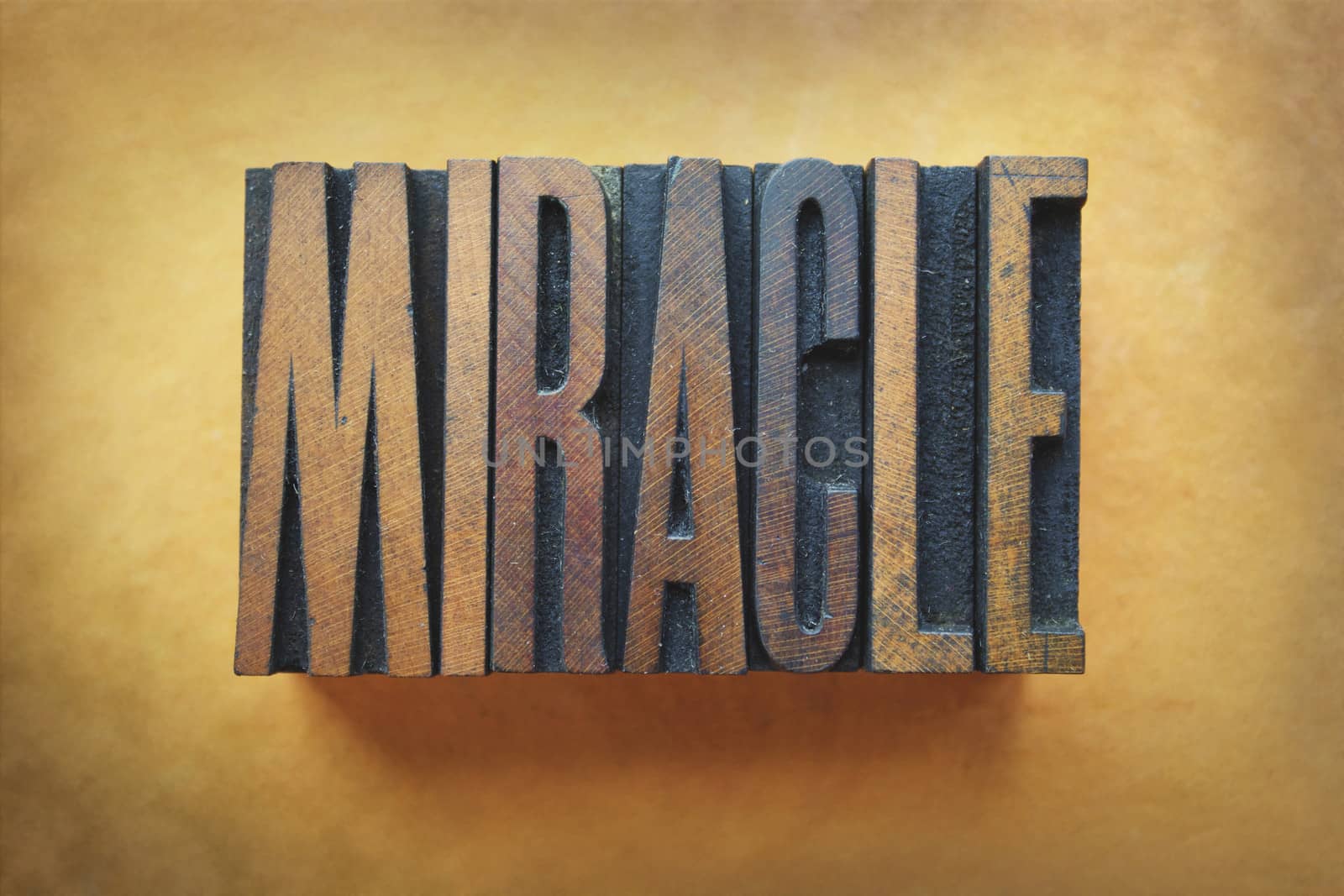 The word MIRACLE written in vintage letterpress type.