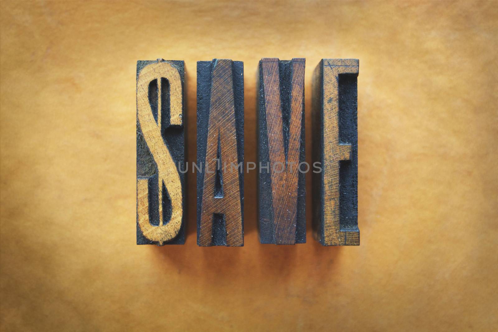 The word SAVE written in vintage letterpress type.