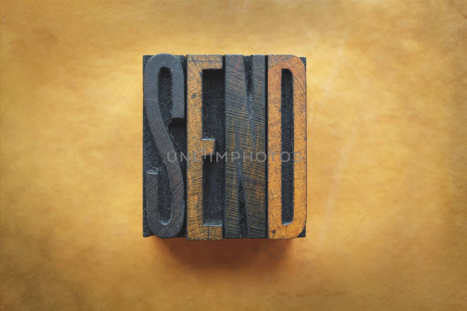 The word SEND written in vintage letterpress type.