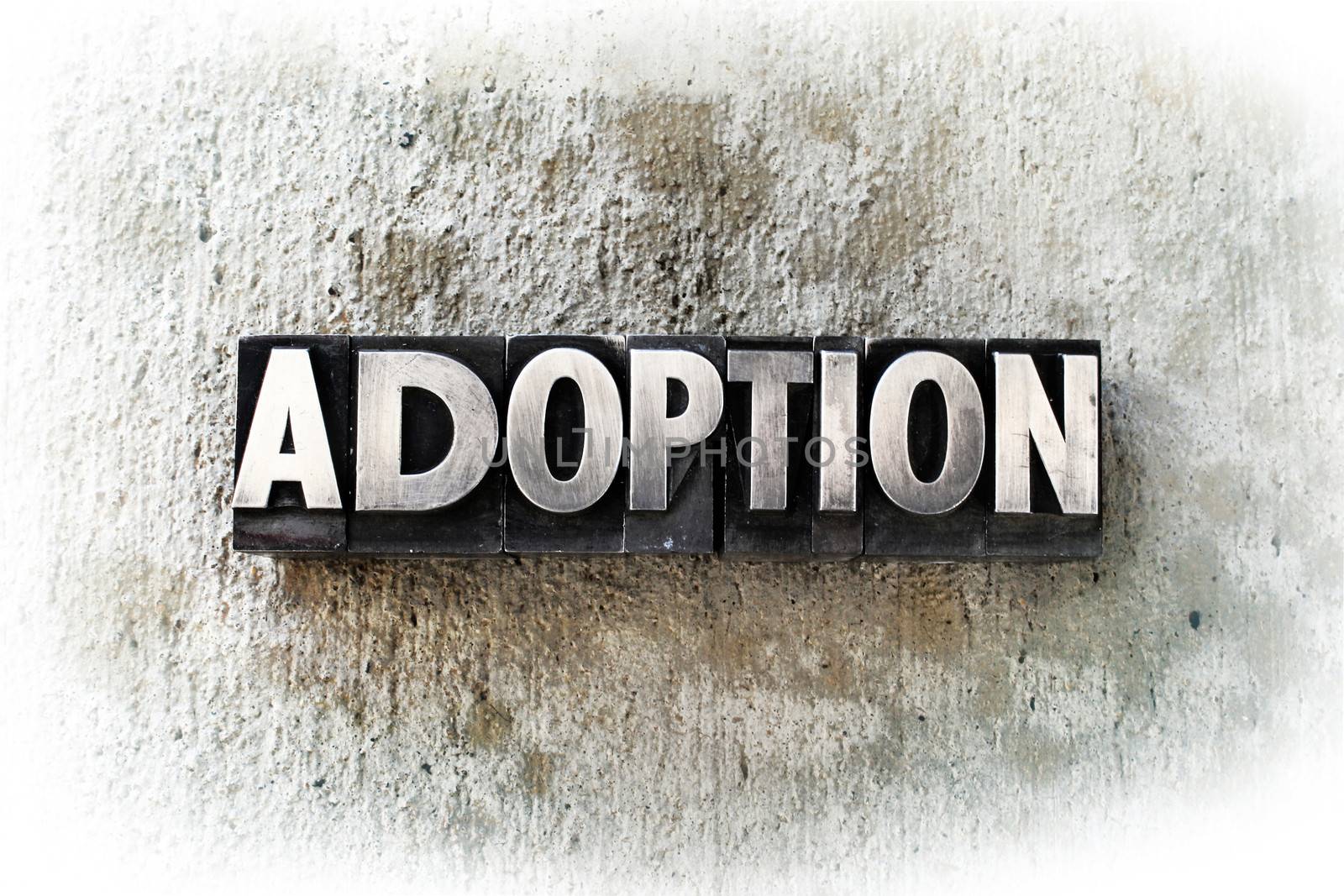 The word "ADOPTION" written in old vintage letterpress type.