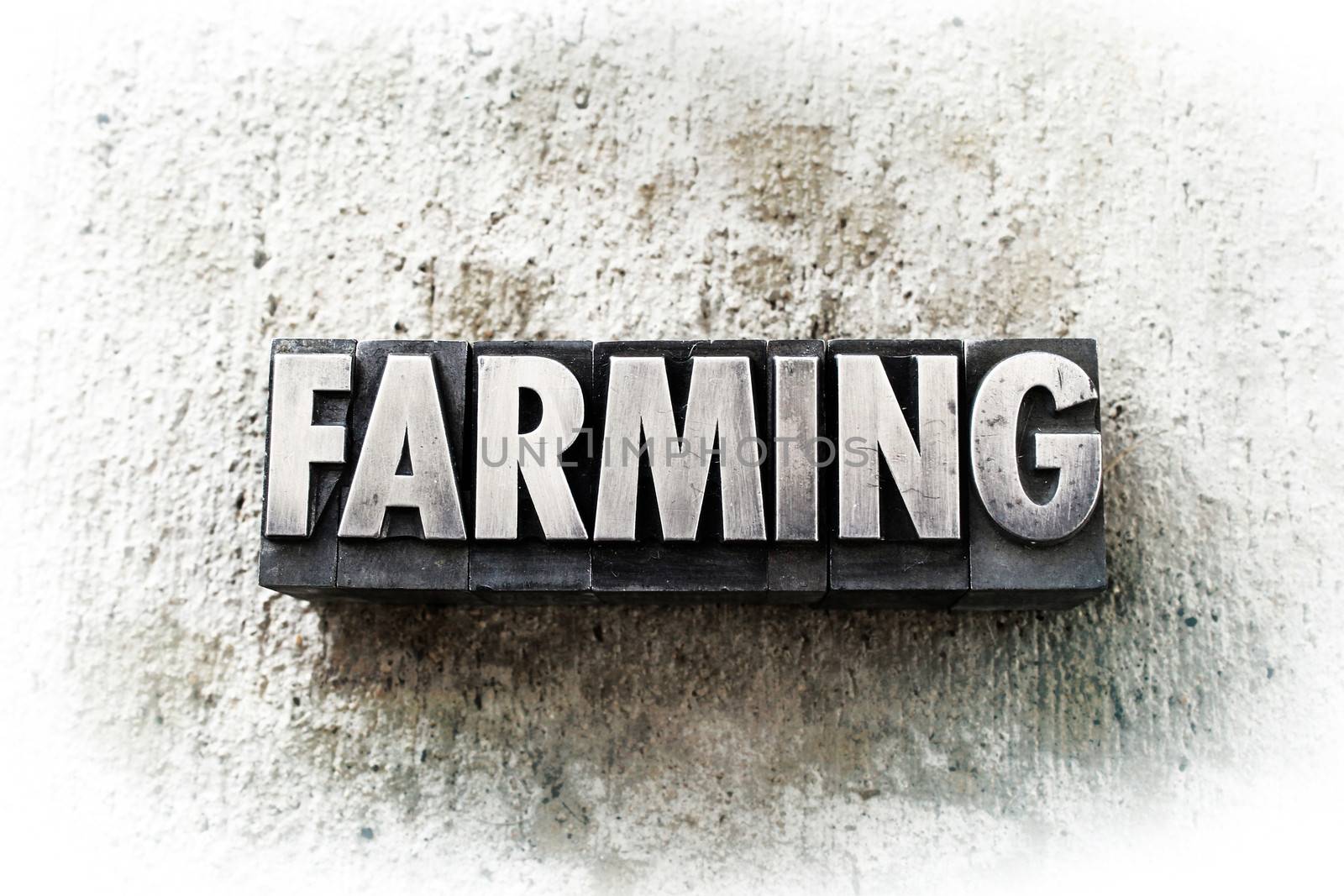 The word "FARMING" written in old vintage letterpress type.