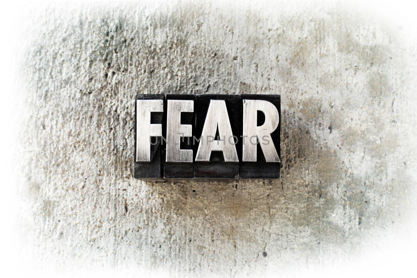 The word "FEAR" written in old vintage letterpress type.