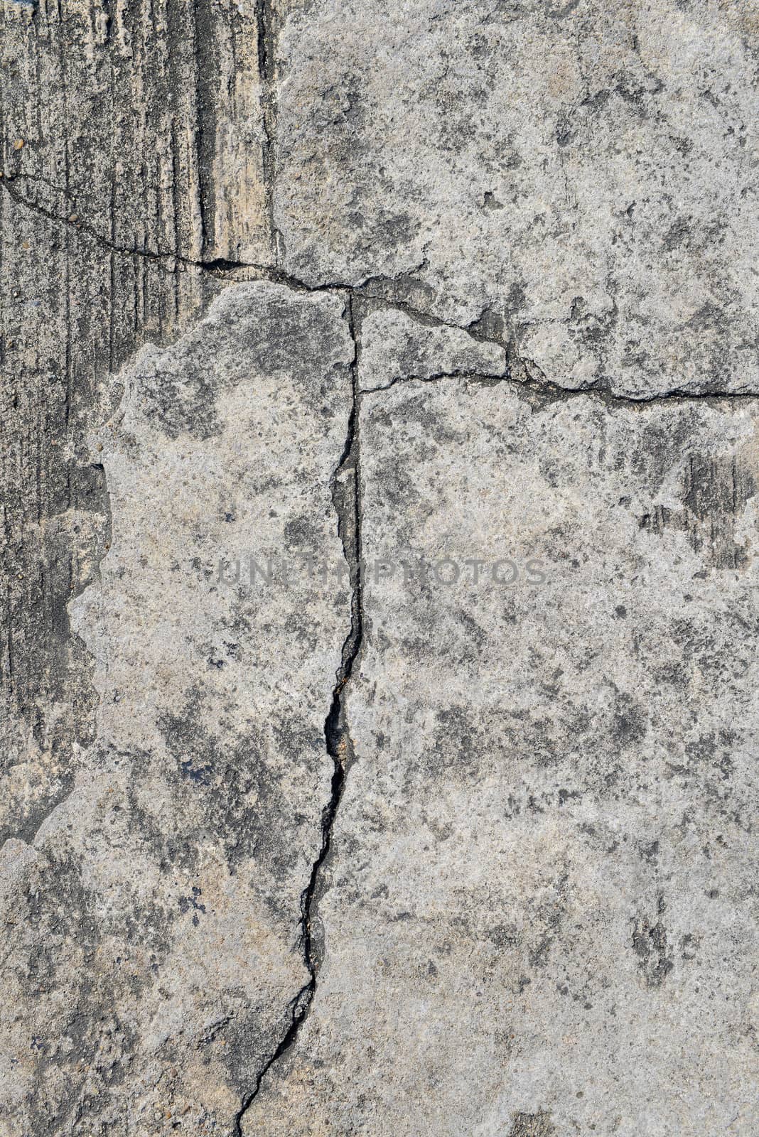 Cracked concrete texture closeup background.  by opasstudio