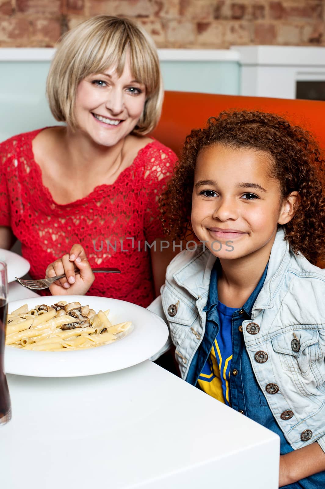 Daughter enjoying meal with her mother