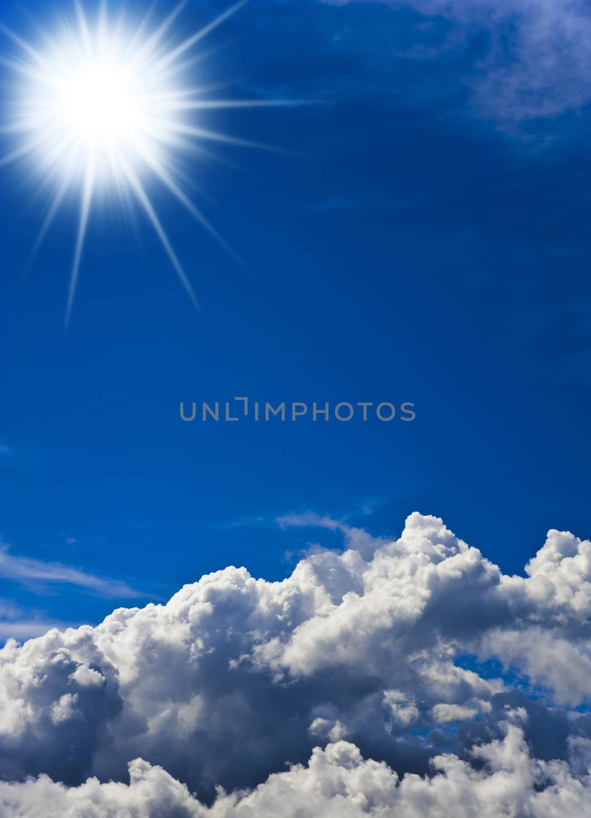 Vertical image of a blue sky with white clouds