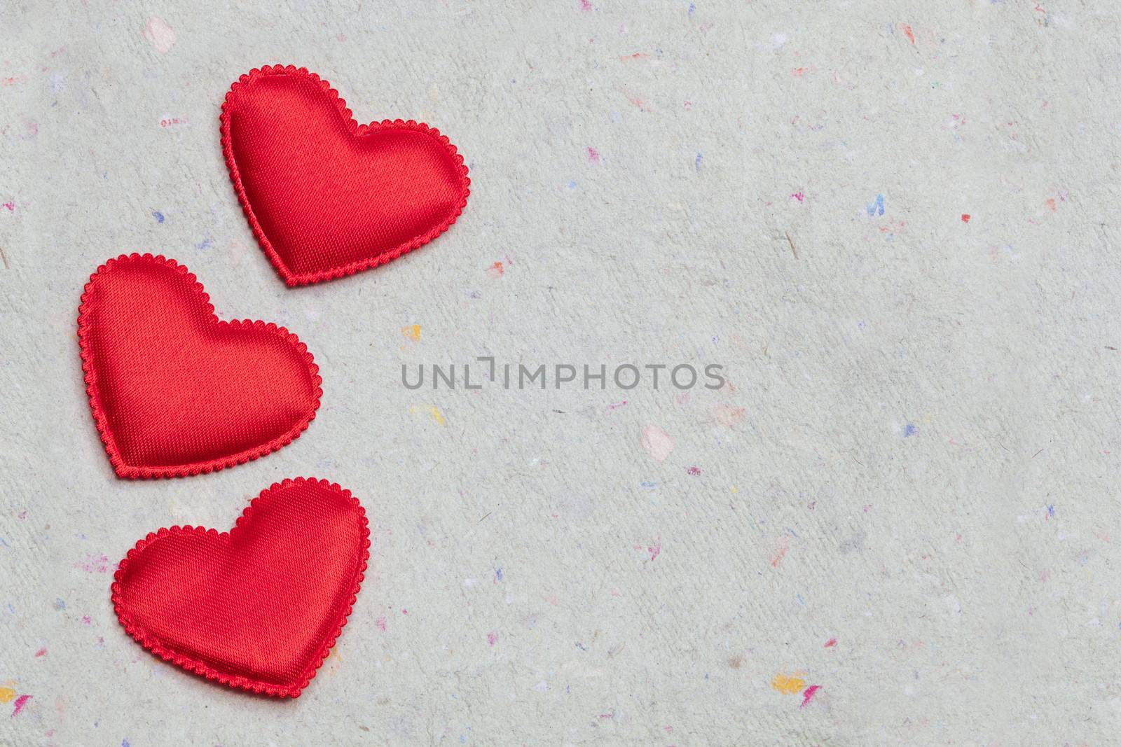 red hearts on vintage  paper background by anelina