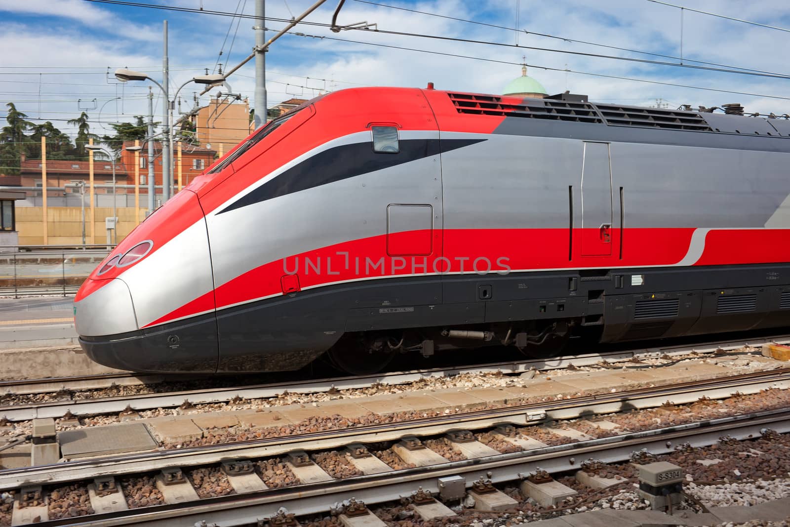 Modern train approaching station the station, Italy