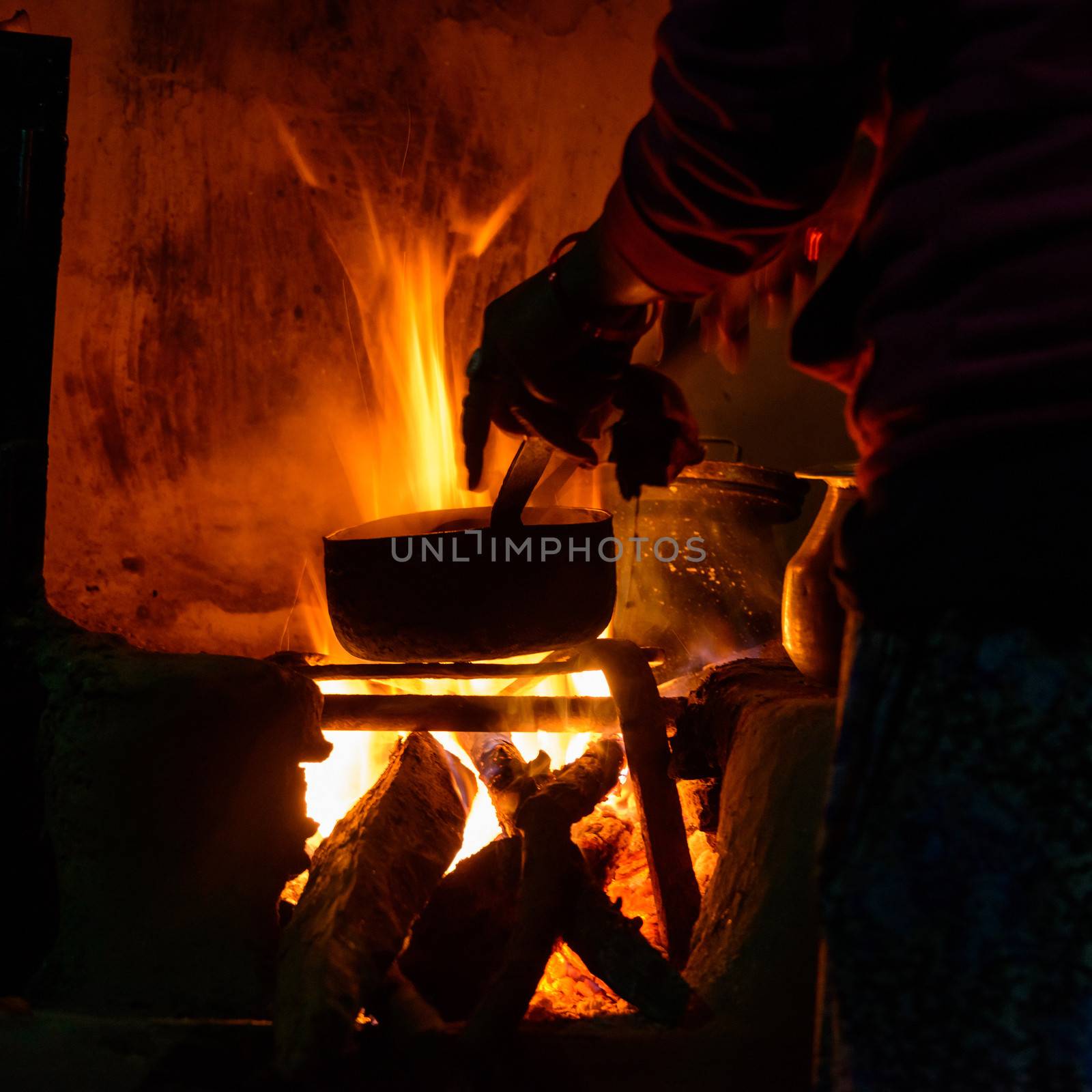 Cooking on wood fire by dutourdumonde
