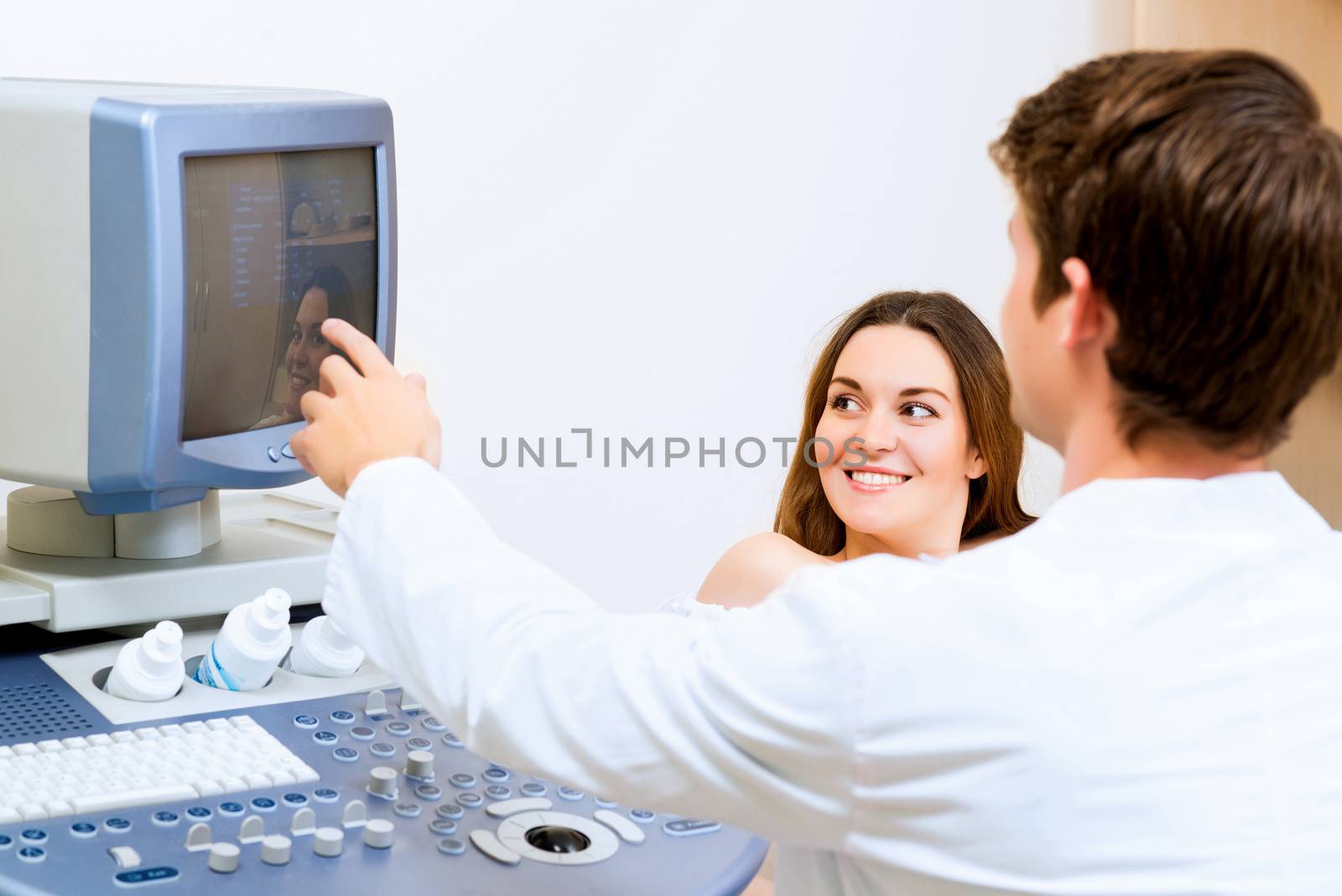 young pregnant woman on the ultrasound, health check