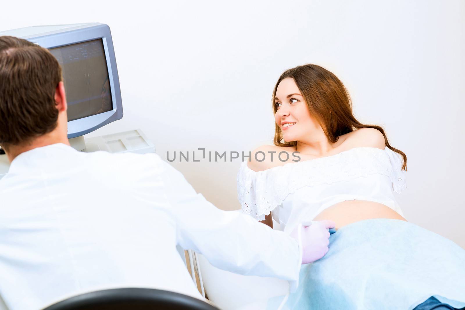 pregnant woman on reception at the doctor by adam121