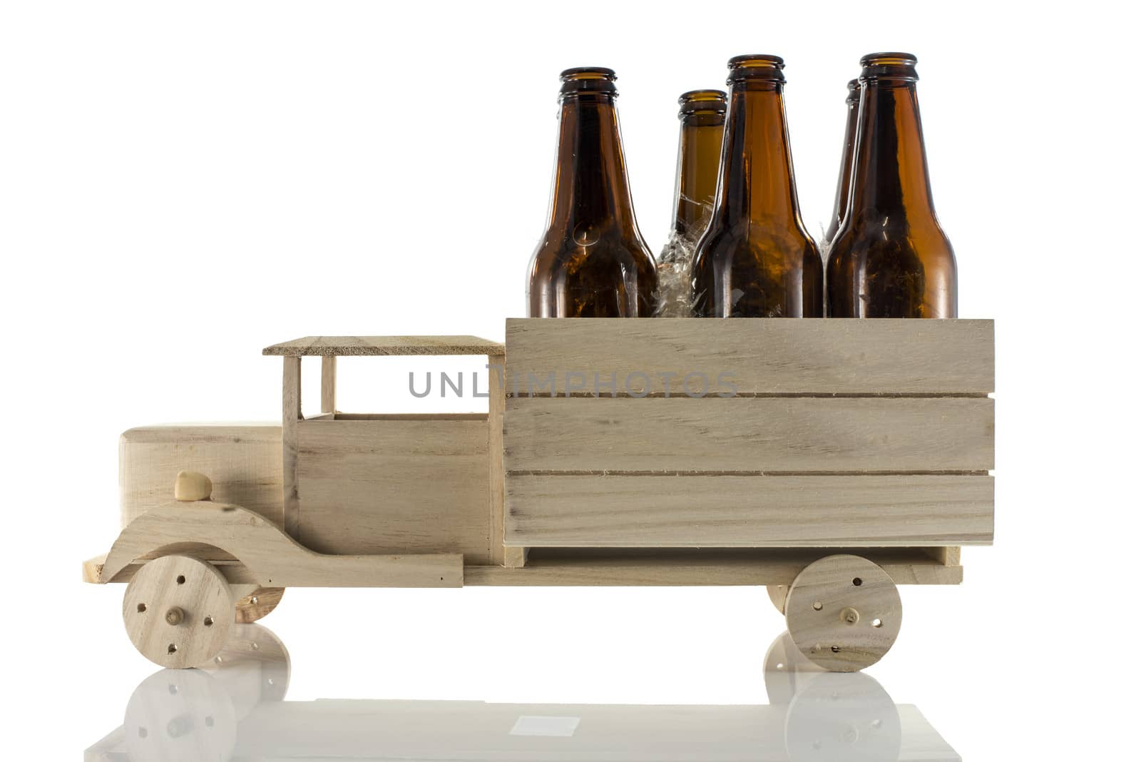 wooden car with beer bottles isoalted on white