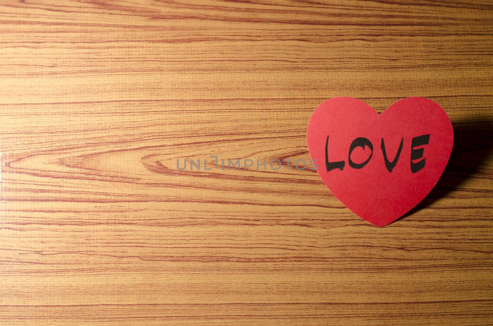 red heart word LOVE on wood vintage stlye background