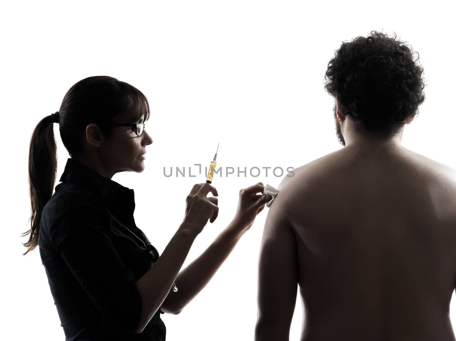 one woman doctor holding surgical needle vaccination silhouette studio isolated on white background