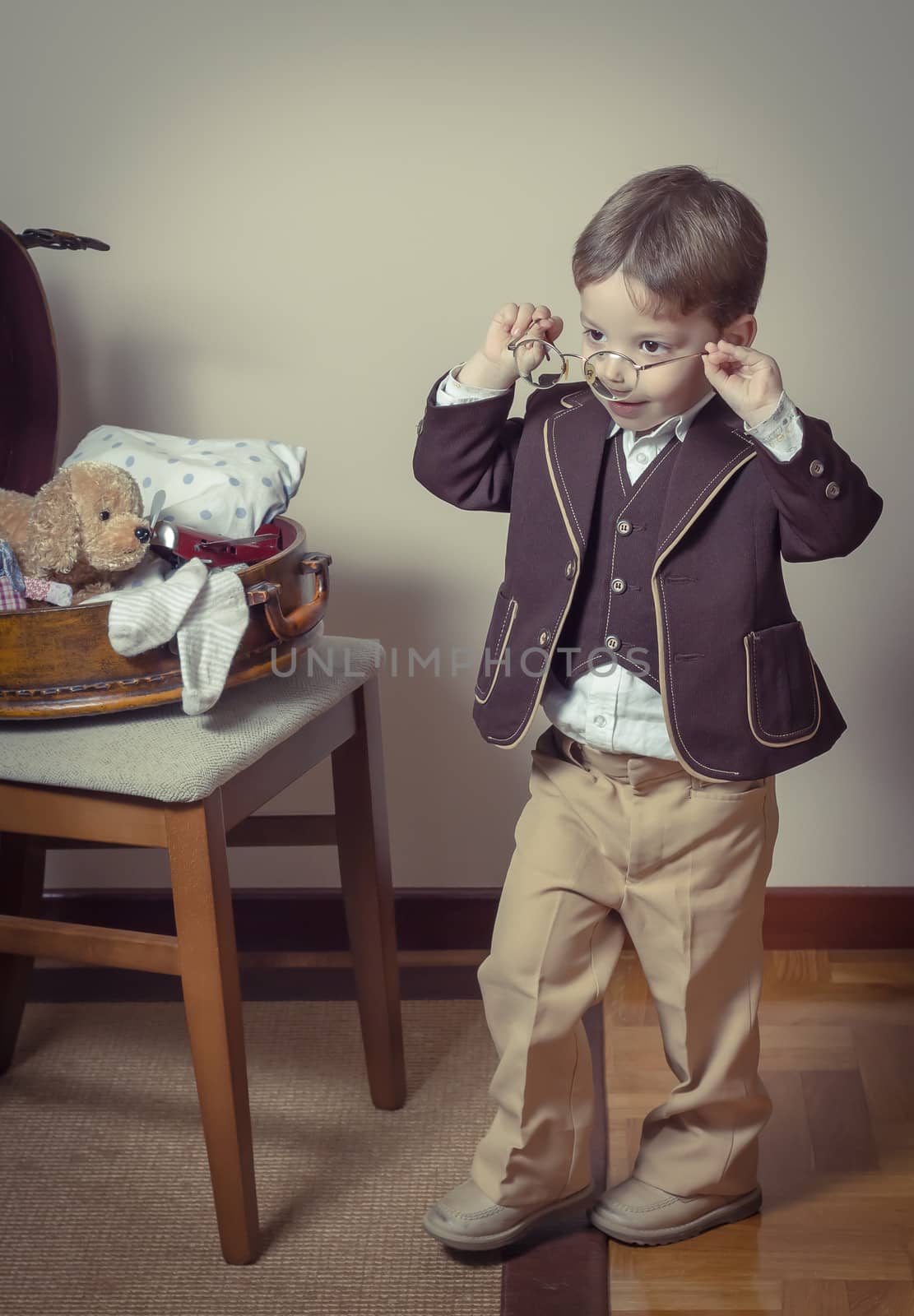 Vintage portrait of boy playing with old glasses by doble.d