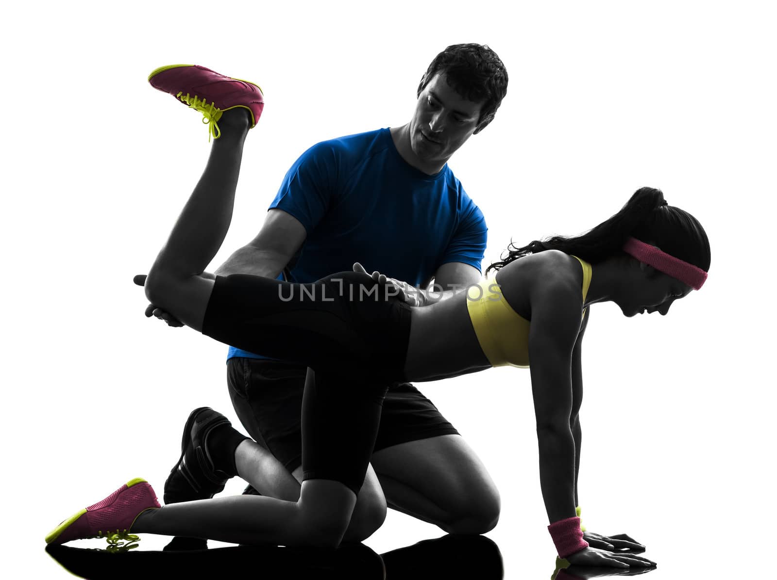 one woman exercising fitness workout with man coach in silhouette on white background