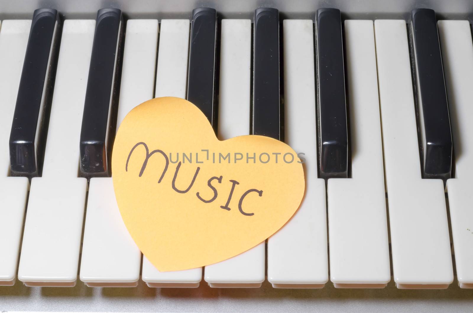 heart on key piano say love music