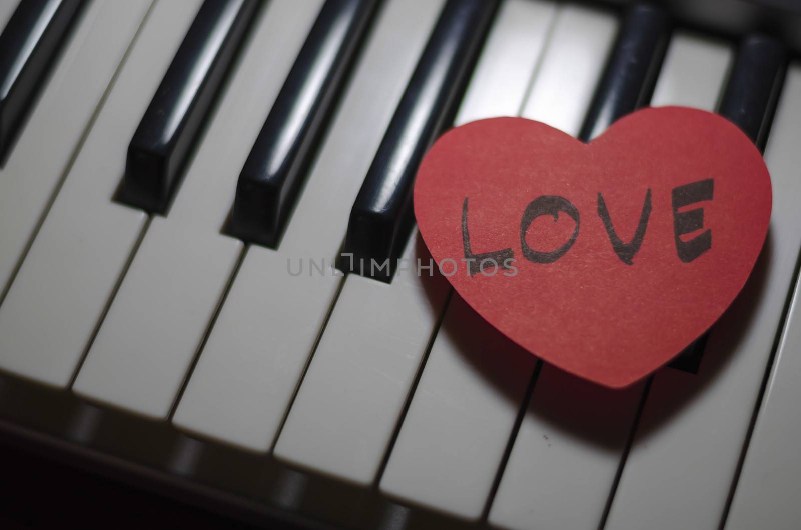 heart on key piano say love music