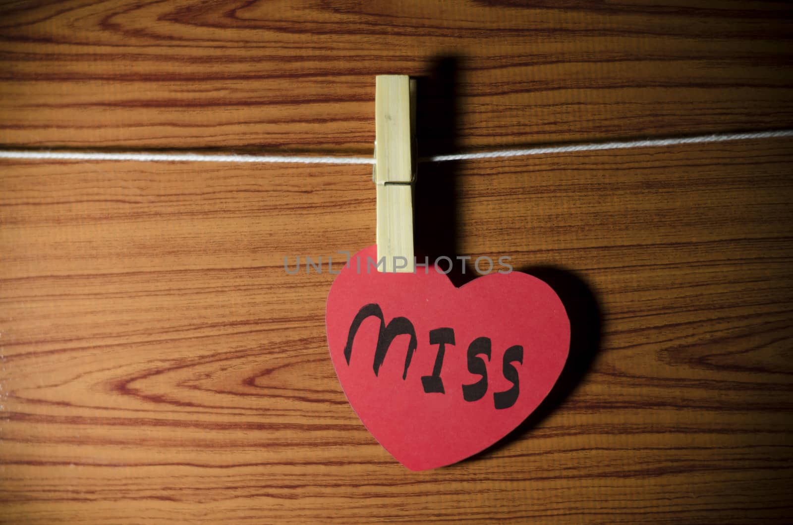red heart word miss on wood vintage stlye background