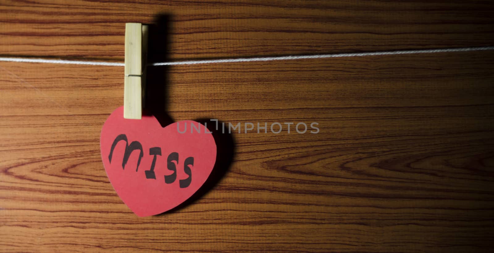 red heart word miss on wood vintage stlye background