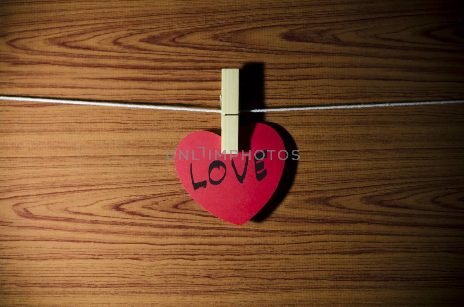 red heart word LOVE on wood vintage stlye background