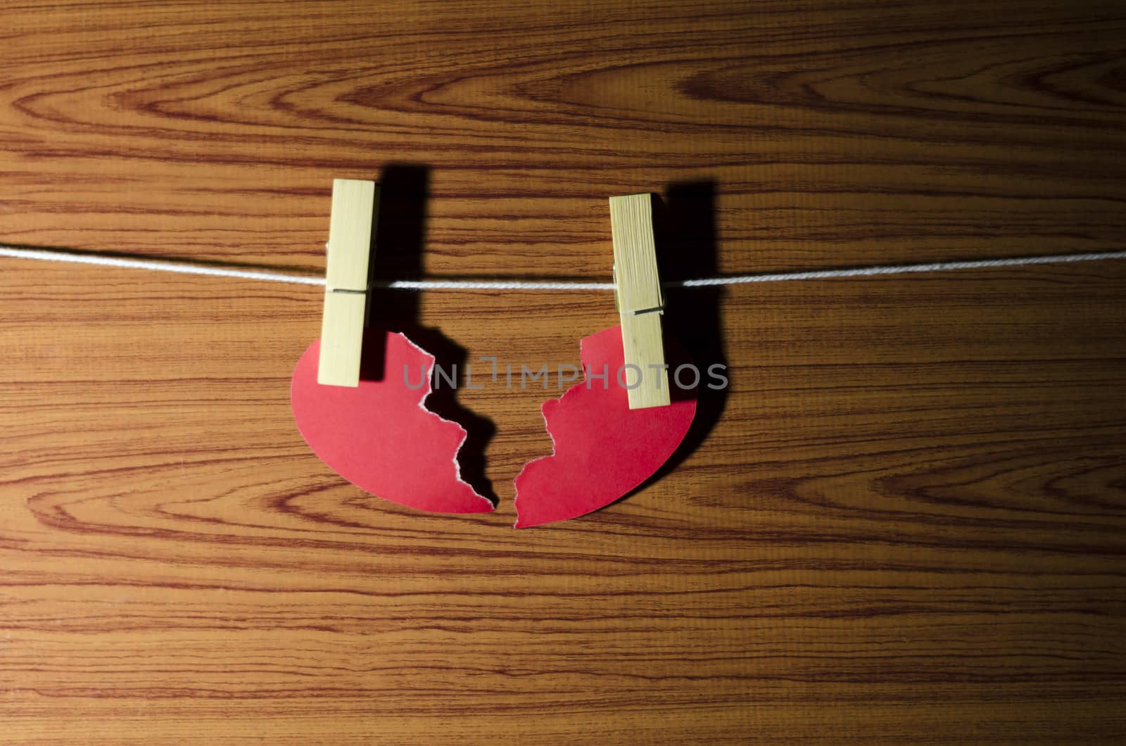 broken red heart word on wood vintage stlye background