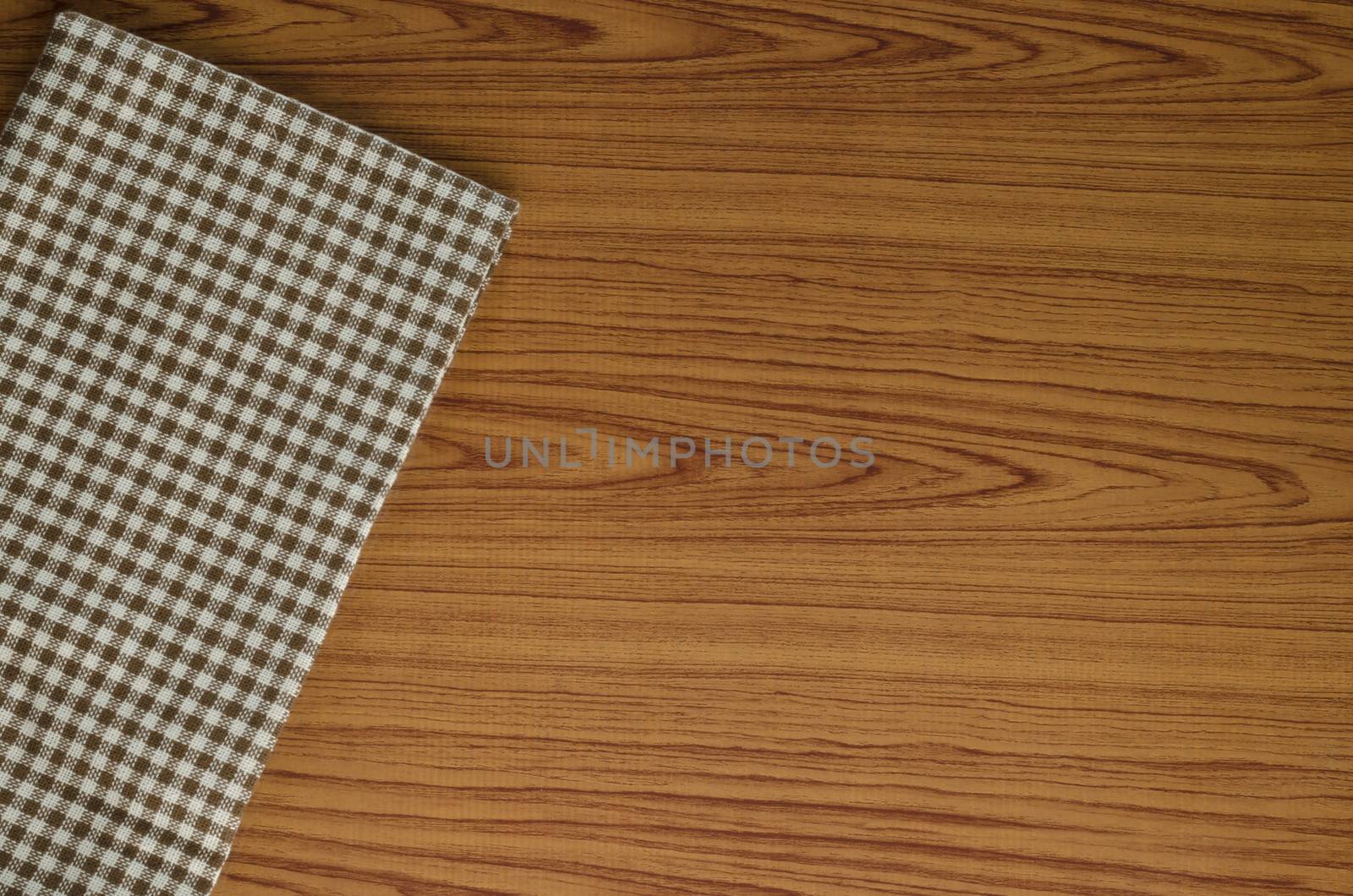 brown kitchen towel pattern on wood background