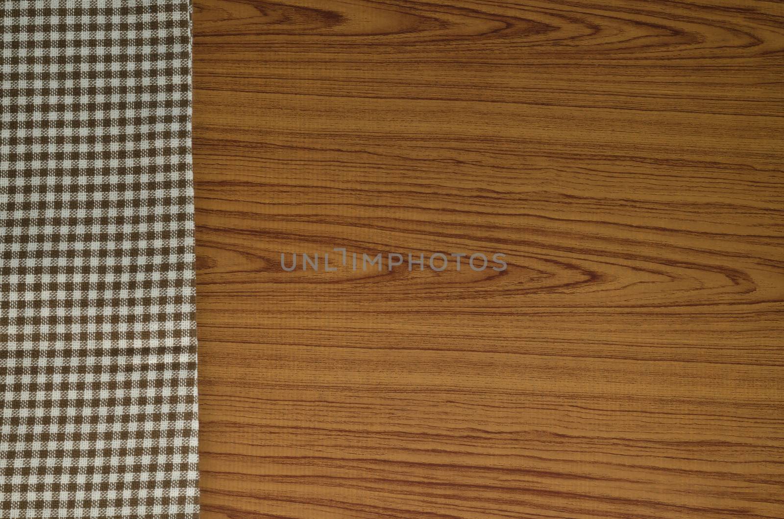 brown kitchen towel pattern on wood background