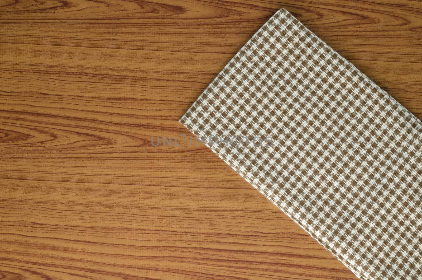 brown kitchen towel pattern on wood background