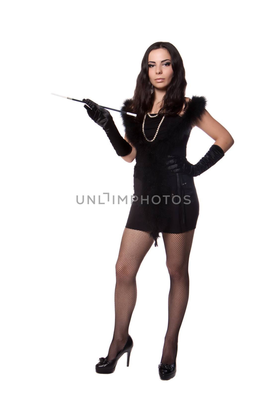 Young woman in retro clothes posing with a cigarette holder, on white background