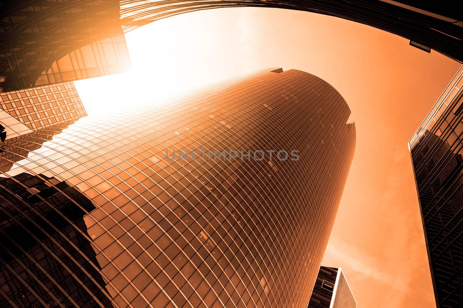 Sunset over skyscrapers in urban area of Paris