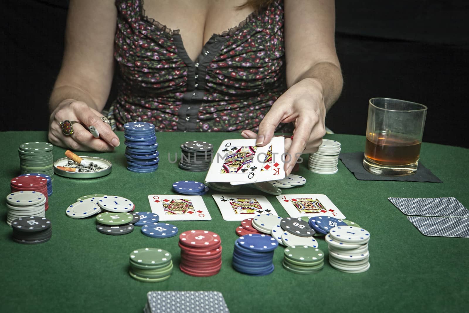 Very beautiful woman playing texas hold'em poker by digicomphoto