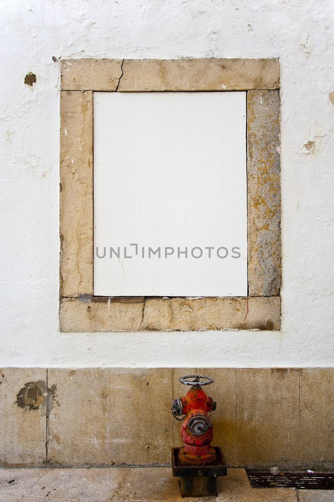 White copyspace in a stone frame with a red hydrant