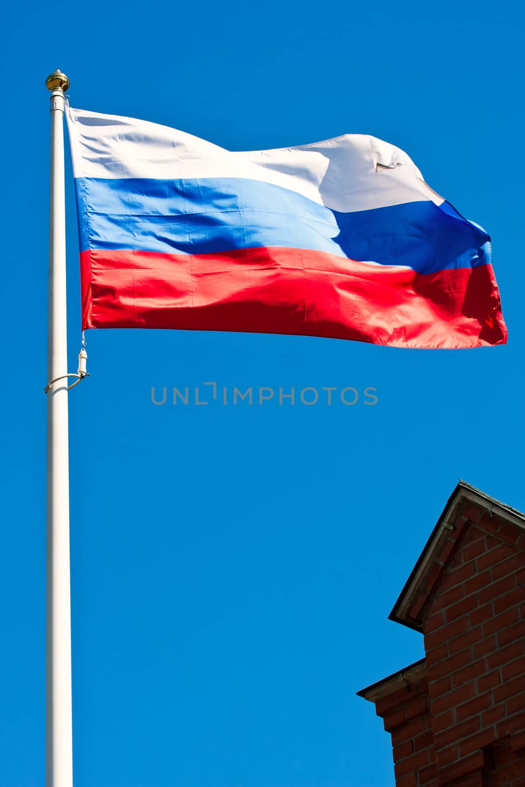 Russian flag on  background of blue sky