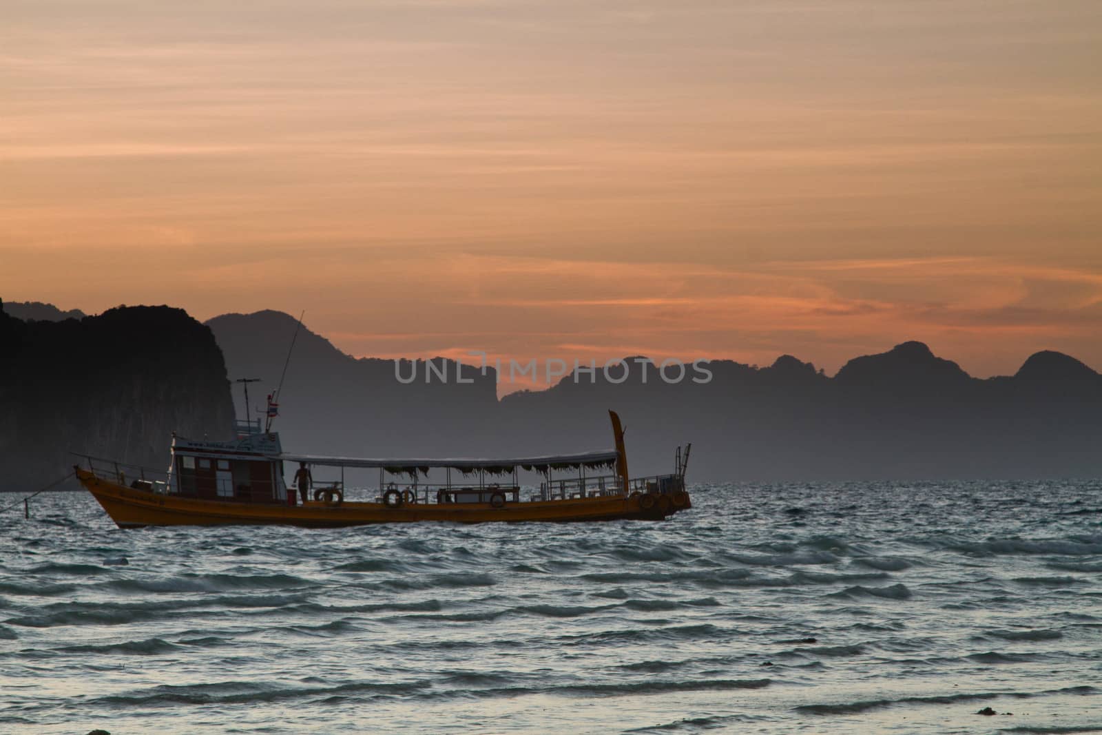 Sunset silhouettes at the beach of the Koh Ngai island Thailand