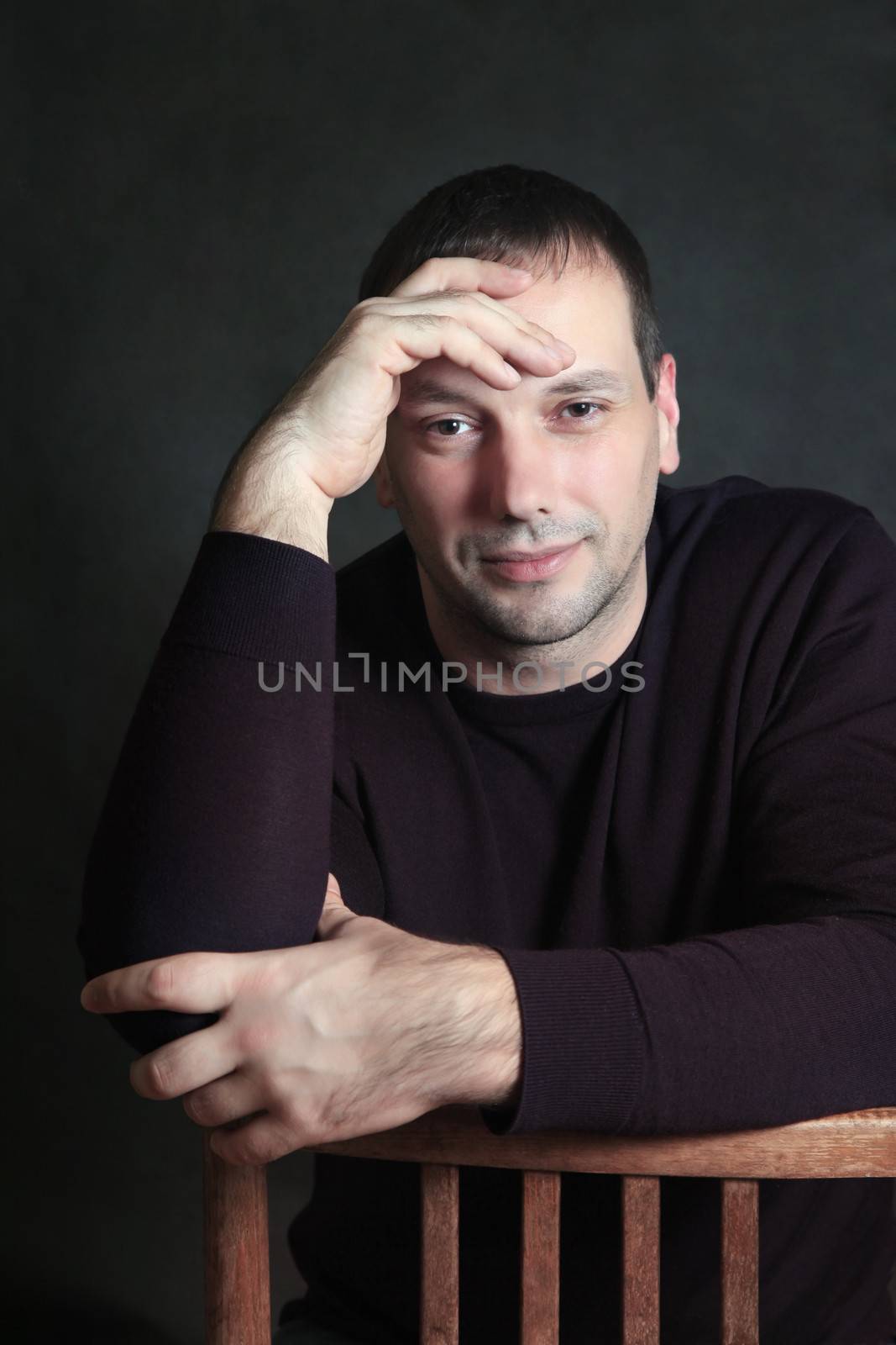 Studio portrait of man isolated on grey background