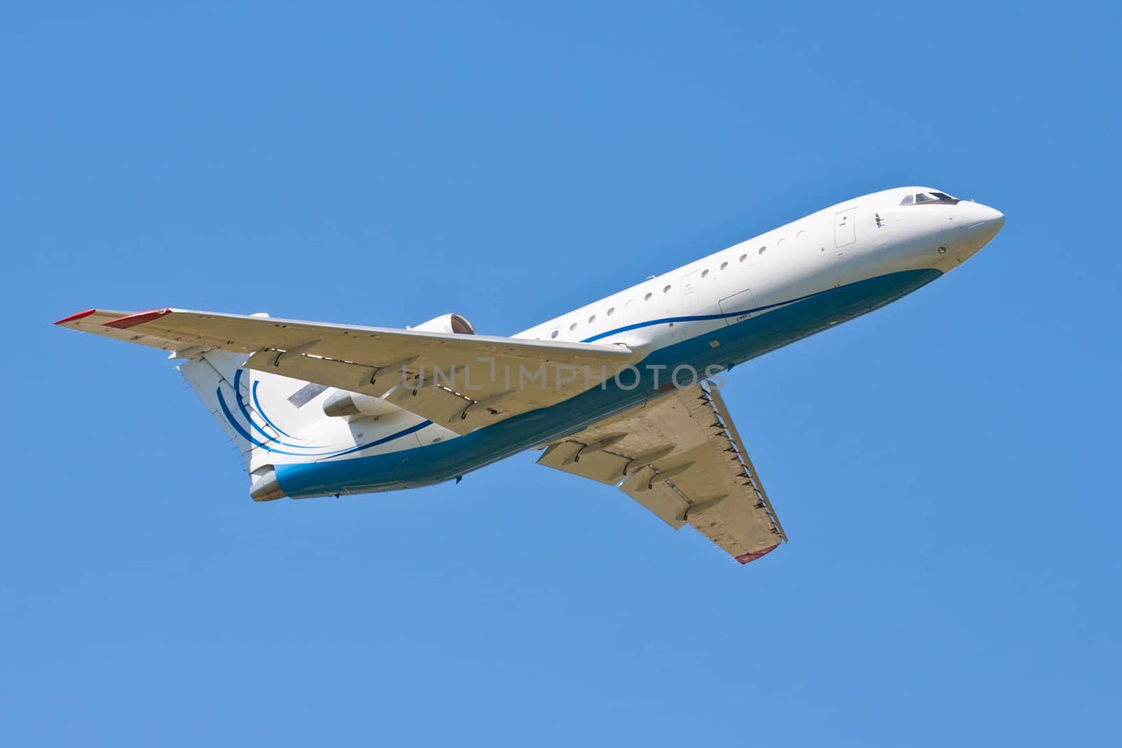 Beautiful white passenger airplane in blue sky