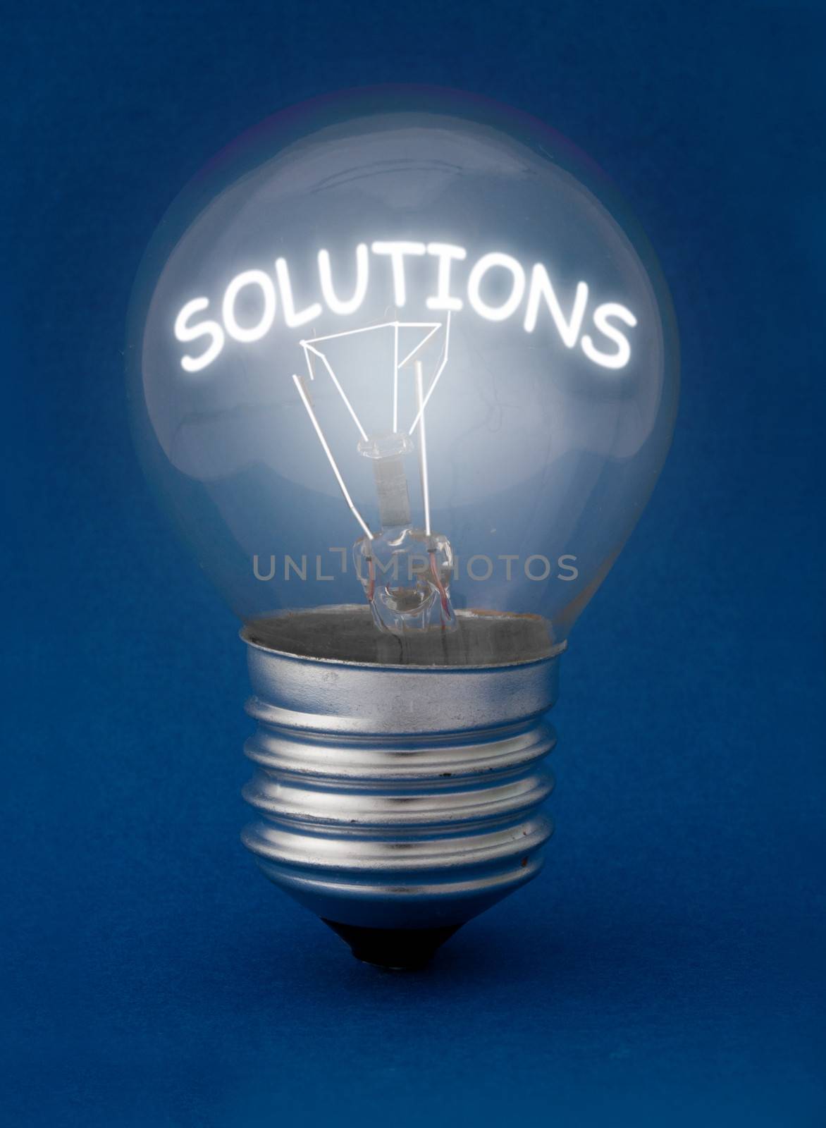 Lit bulb highlighting the word solutions 