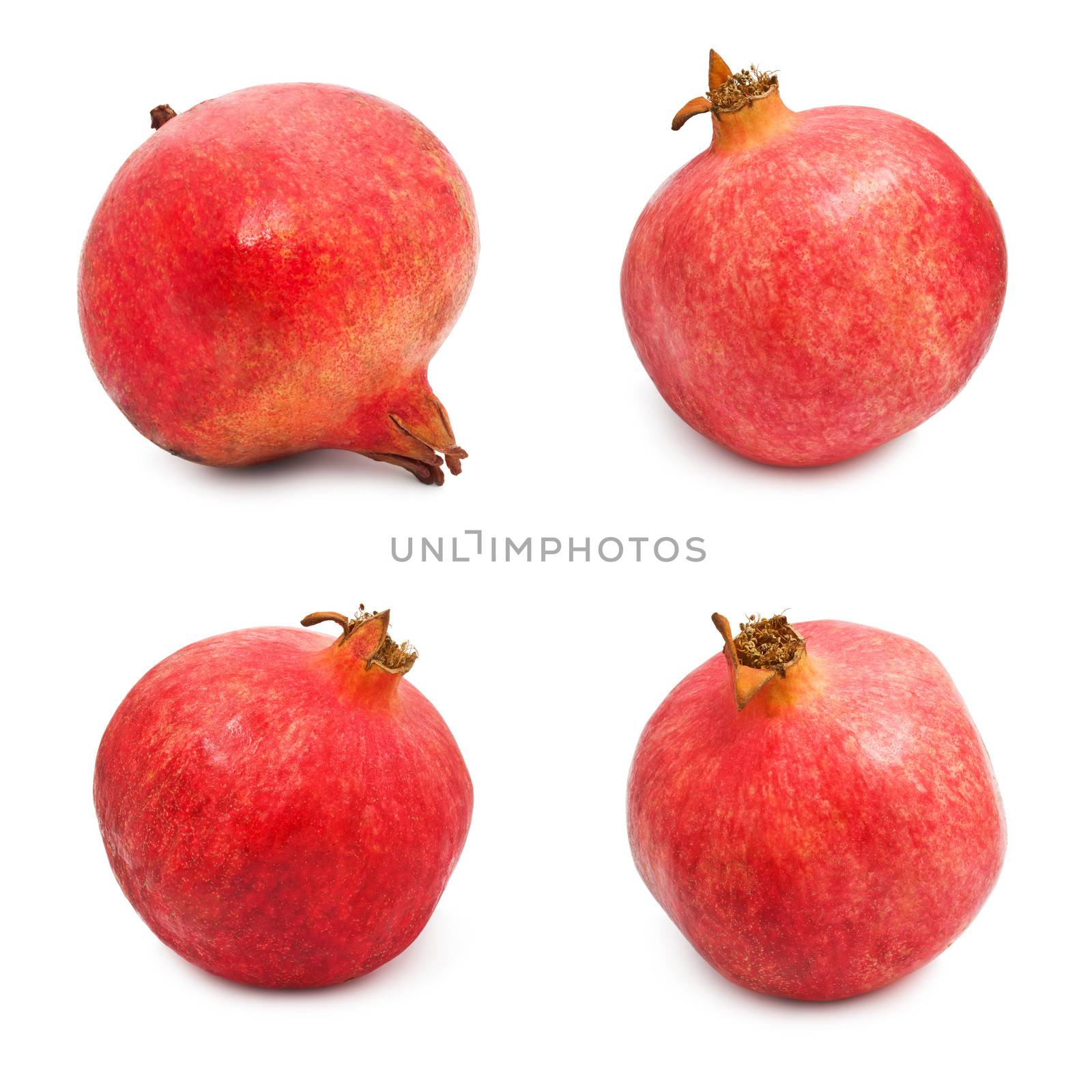 Collection of red pomegranates isolated on white background