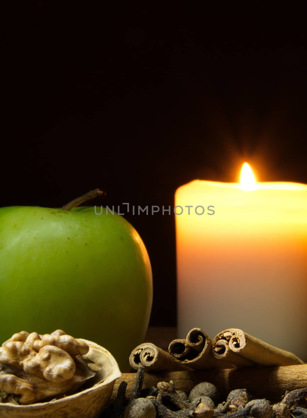 Green apple, cinnamon, walnut and a candle