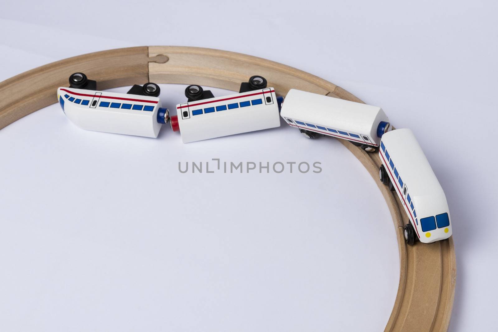 derail wooden toy train in top view. horizontal image