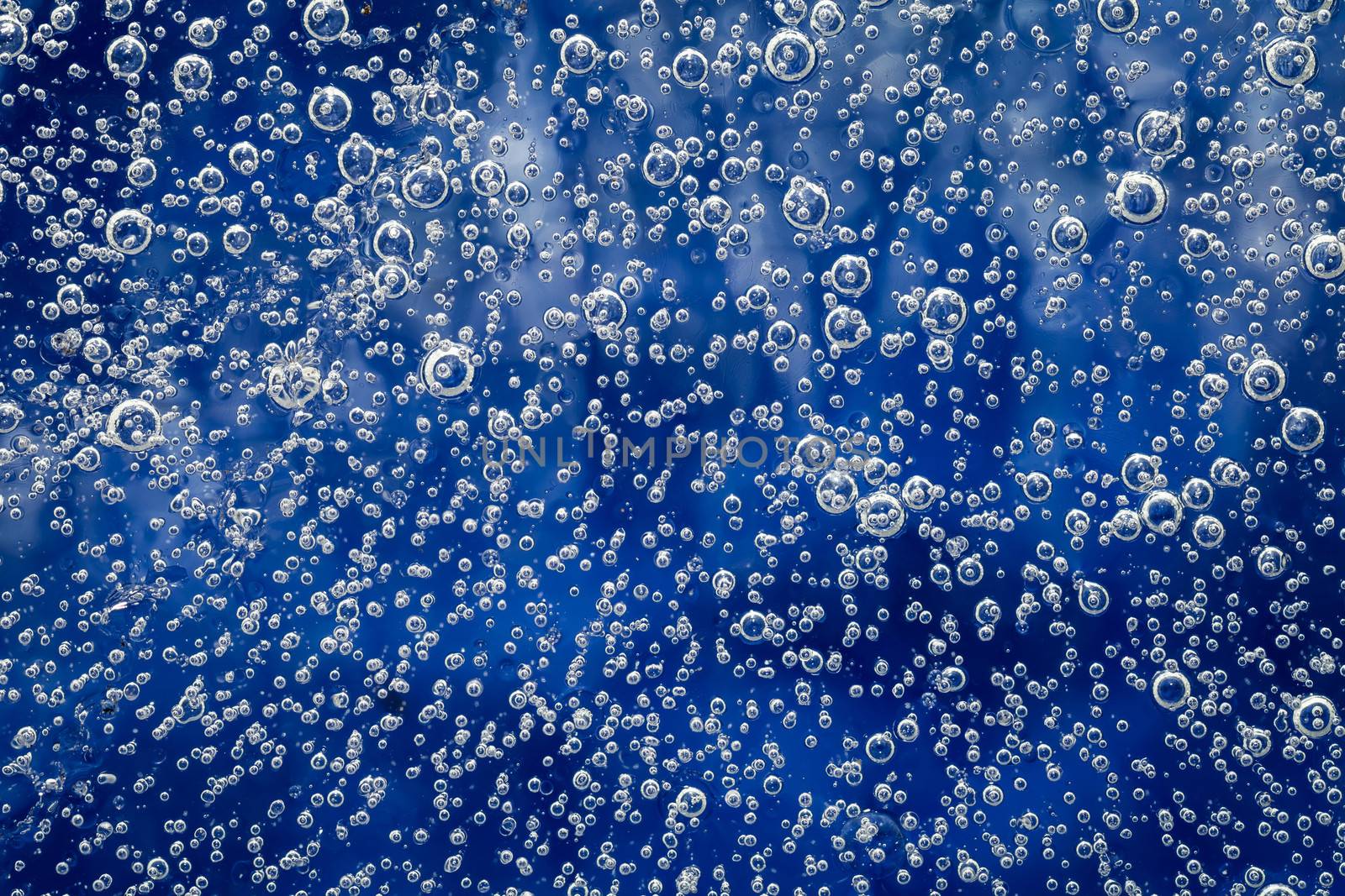 Ice texture with bubbles for background. Natural blue ice pattern