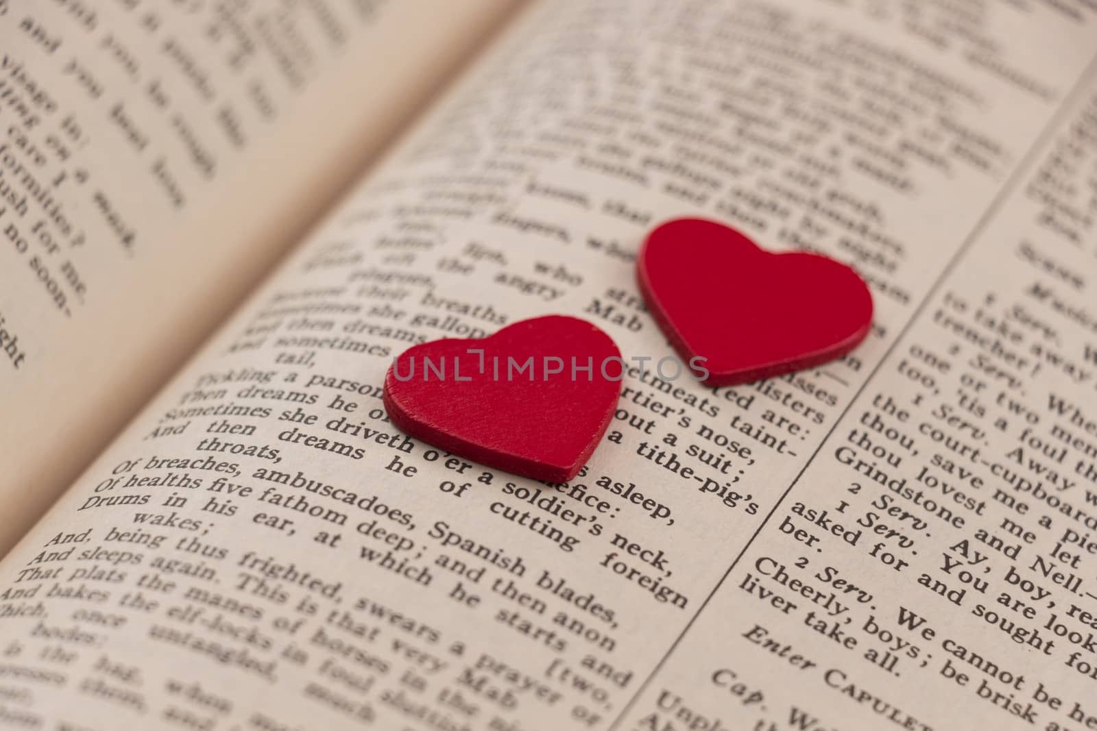 Hearts on a book page by snowwhite